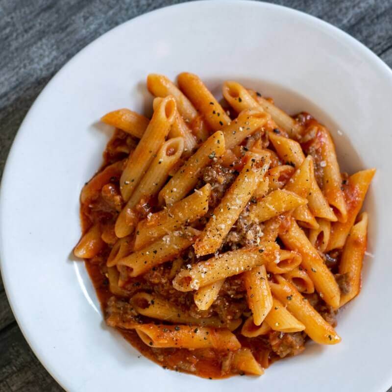 Penne pasta with ground beef and parmesan cheese